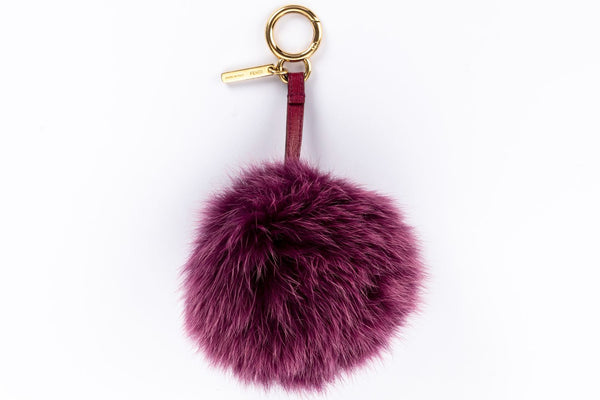 Fendi Pom Pom Bag Charm 紫色皮毛，金色五金配件